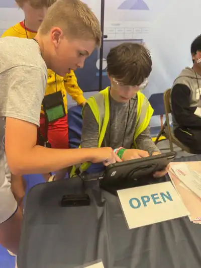 Image of two male student working on an ipad